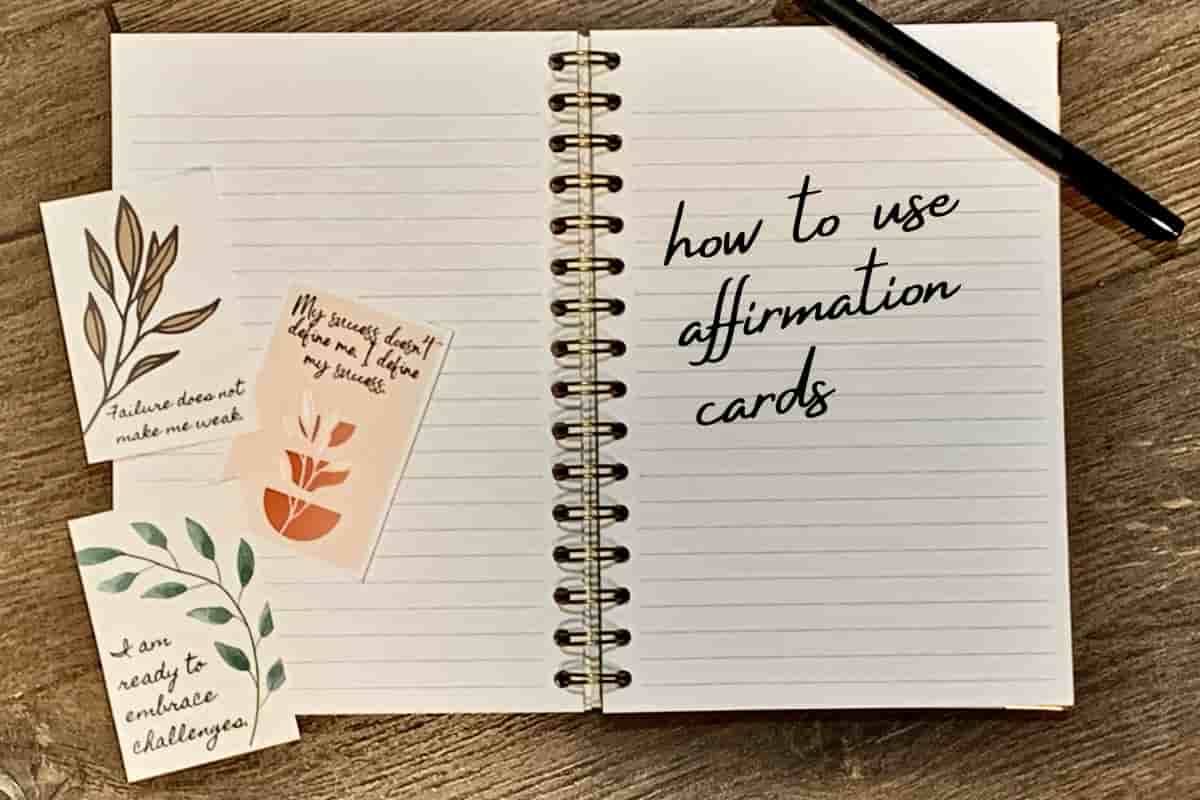 affirmation cards placed on a journal