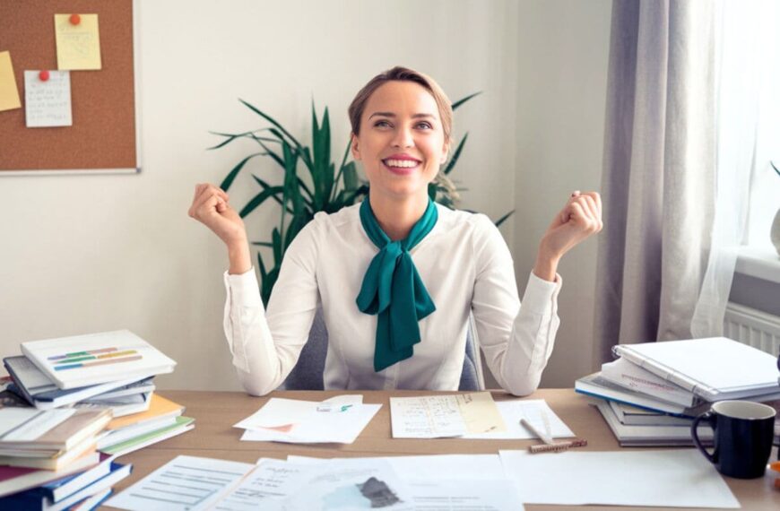 a woman sitting at a desk feeling motivated