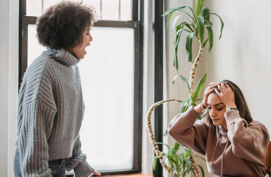 a woman complaining to another woman who looks irritated