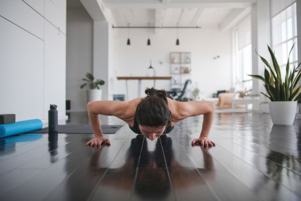 a person exercising in a clean and modern living space
